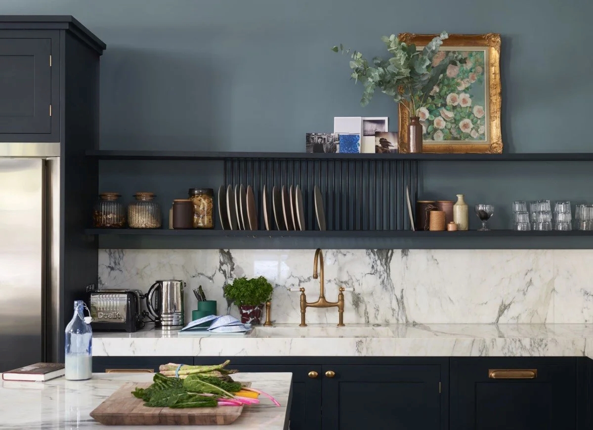 Kitchen cabinets with blue-green color.