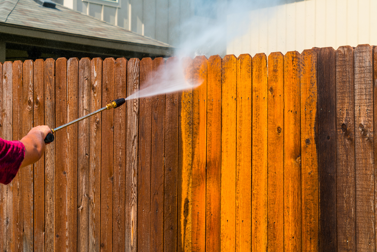 pressure washing a wood fence