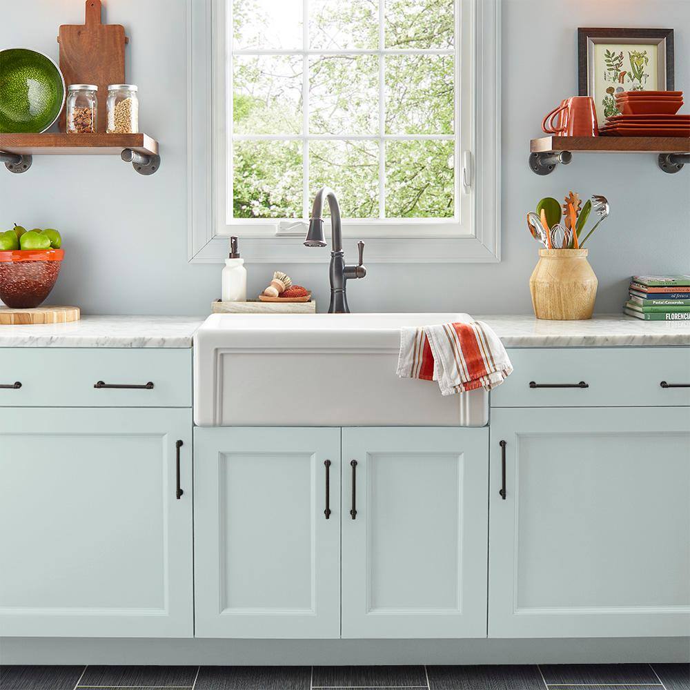 Kitchen cabinets in light blue.