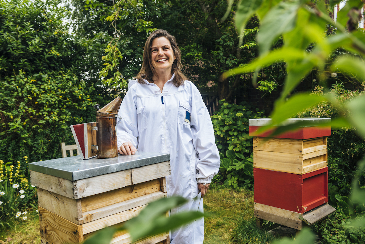 beekeeper with bee boxes