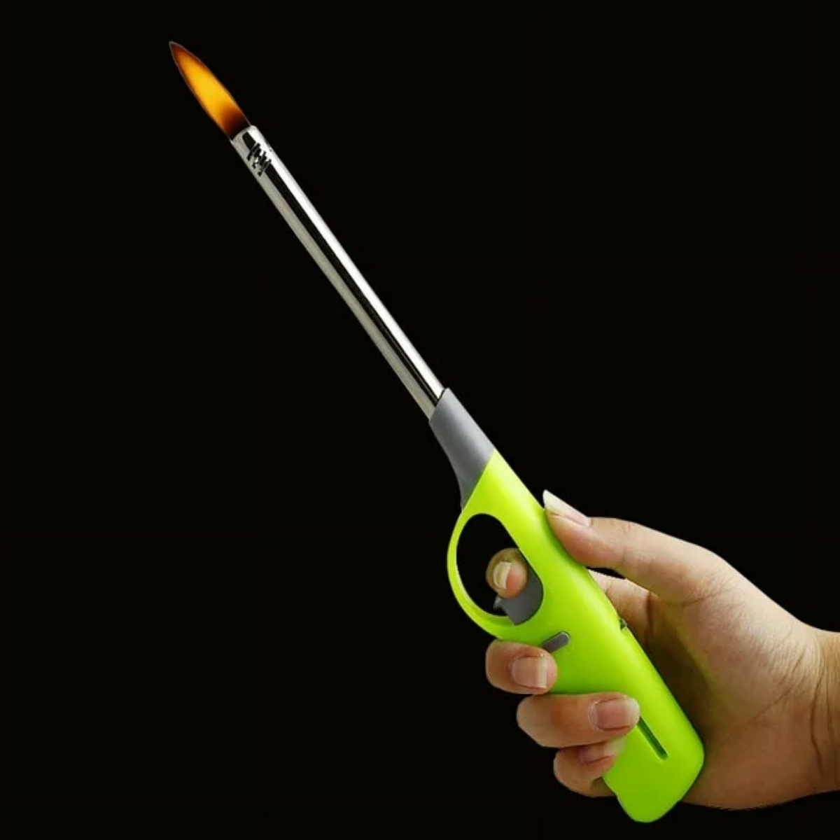 Person holding bbq lighter.