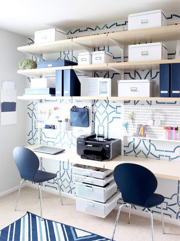 room with two desks and bookshelves