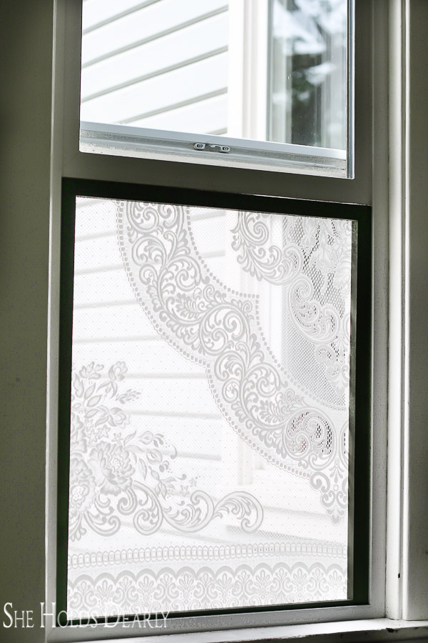 She holds dearly ways to dress up a window lace-window-treatment