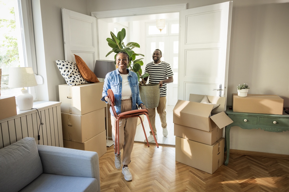 A young couple moving into their new home.