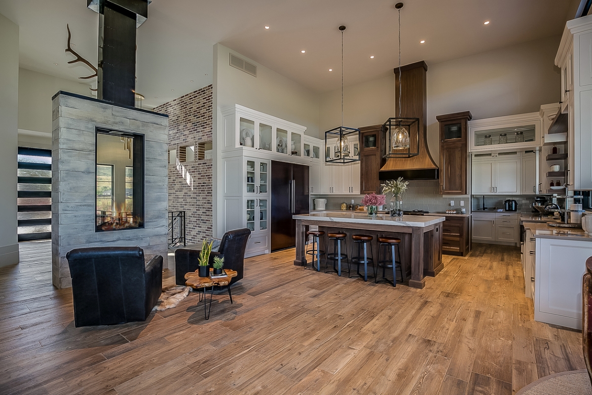 double-sided fireplace - modern stone kitchen fireplace