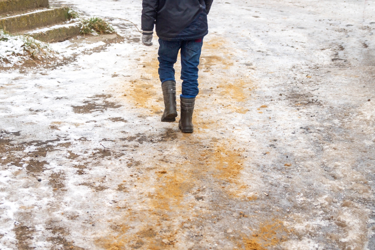 Person walking on icy road