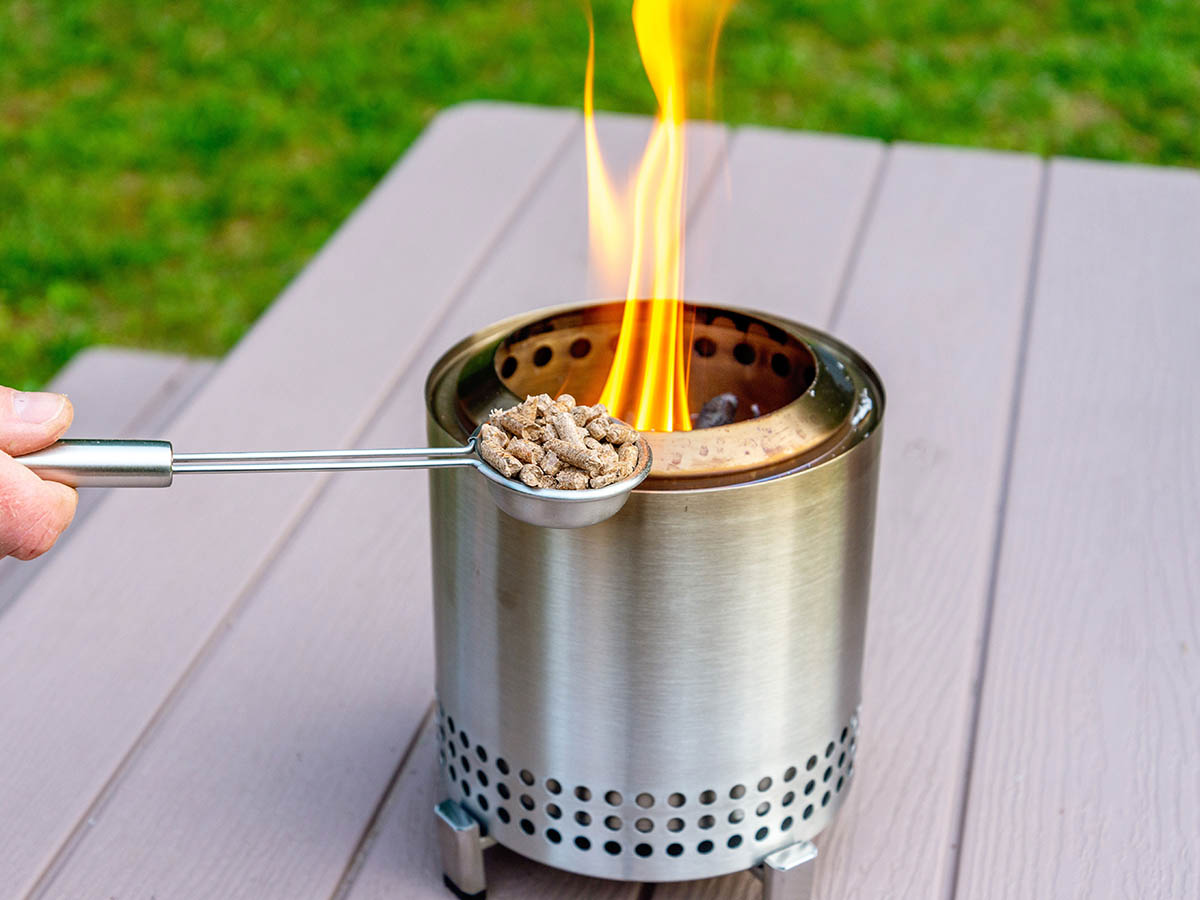 Some using the pellet scoop that is part of the Solo Stove Mesa XL accessory kit