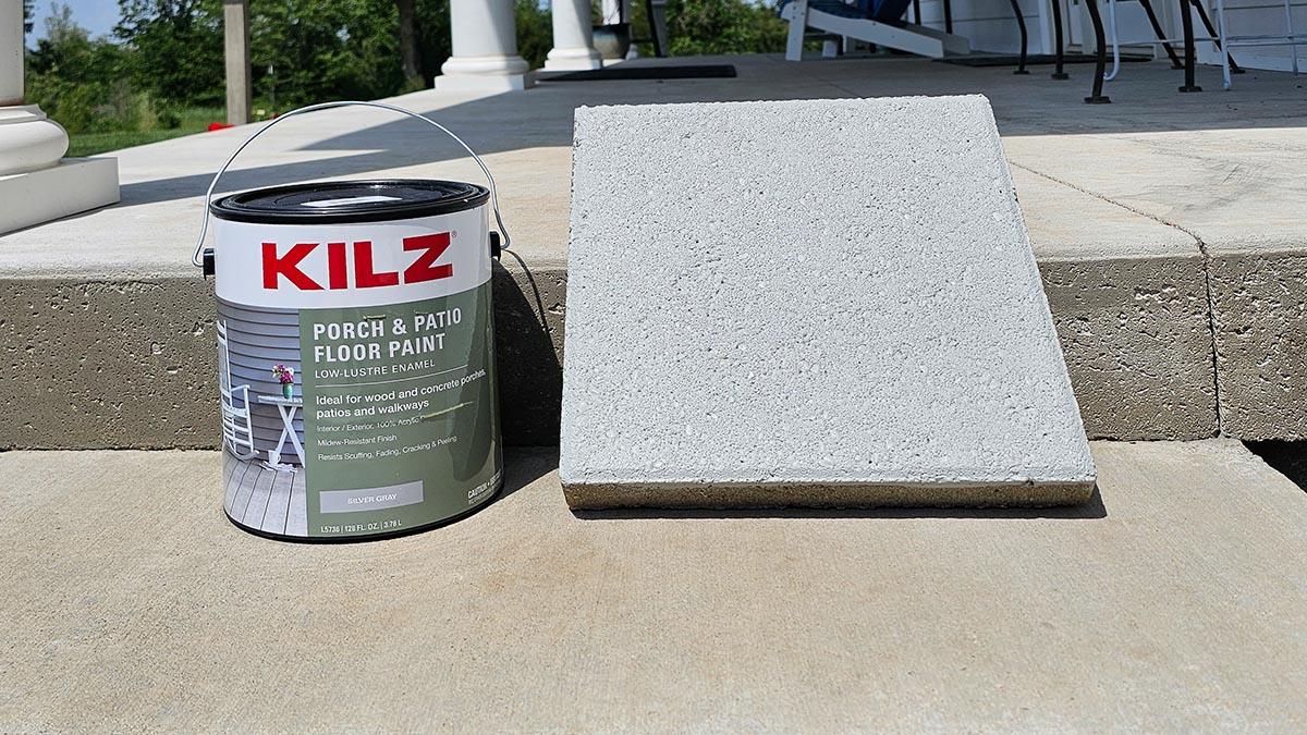 A can of Kilz Porch & Patio Floor Paint next to a concrete paver before testing.