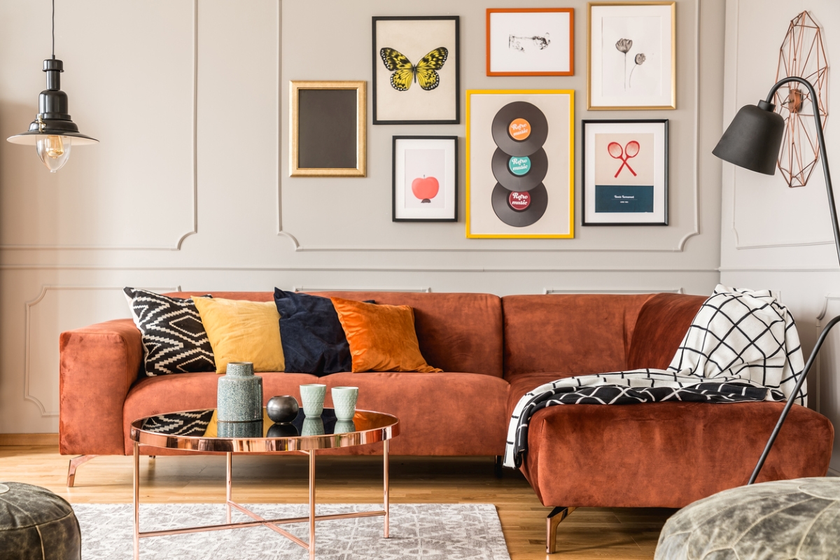 Living room with many framed pieces of art.