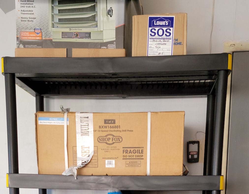 A tight shot of sealed boxes stored on the best garage shelving