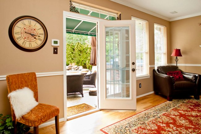 The Best Patio Doors Option open to a patio set with outdoor furniture