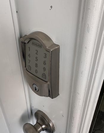 The Schlage Encode Smart Wi-Fi Deadbolt installed on a residential door for hands-on testing.