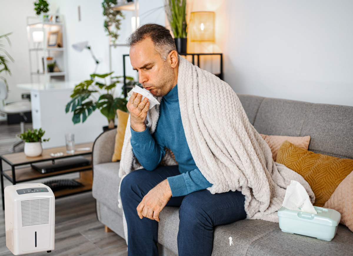 Man sneezing in his house