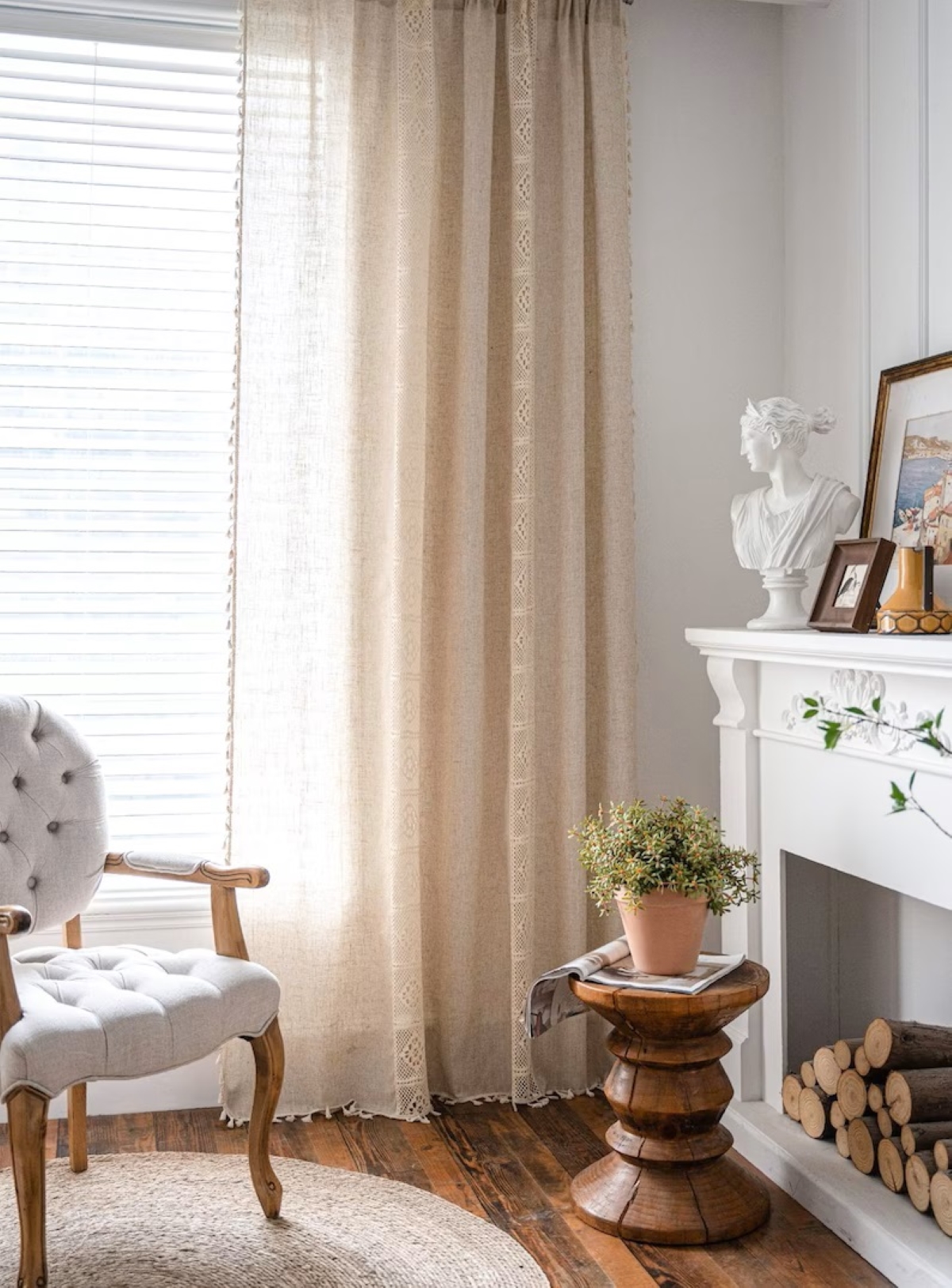 Sheer tan bohemian curtains in corner of living room