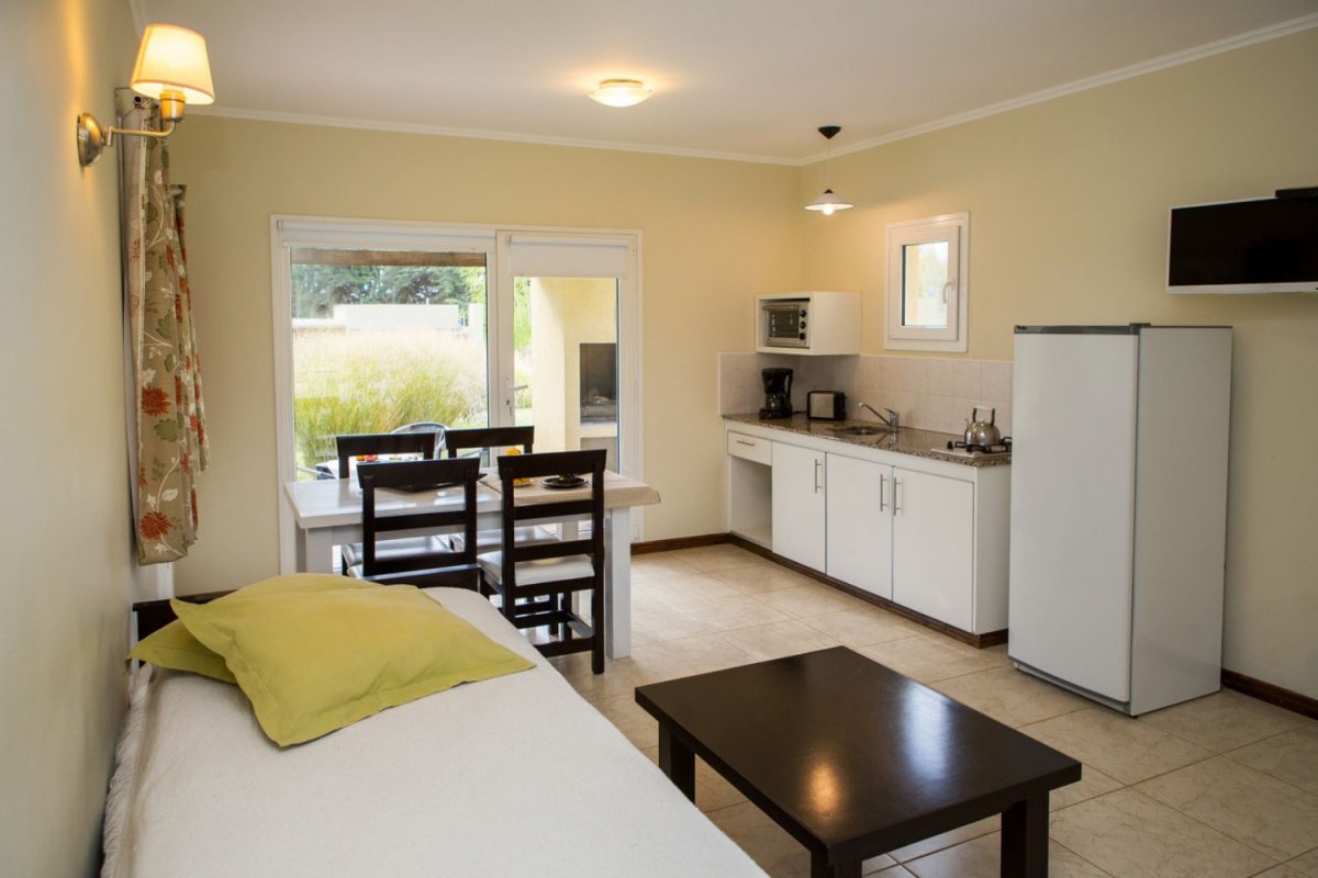 A view of a clean kitchenette. 