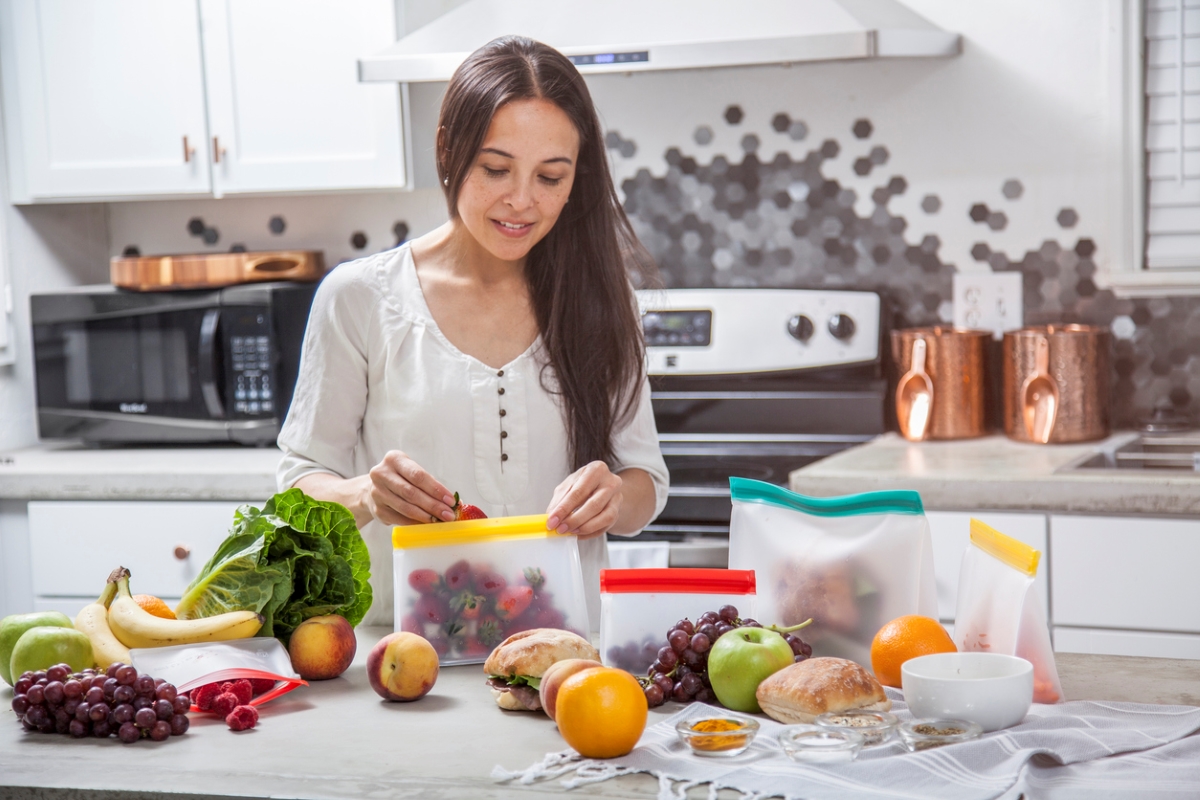 ways to save money at home - woman using reusable bags