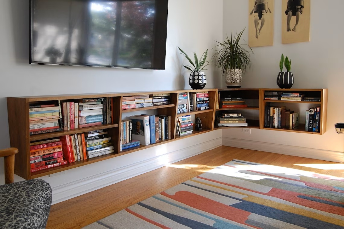 Floating mid-century wooden bookshelf.