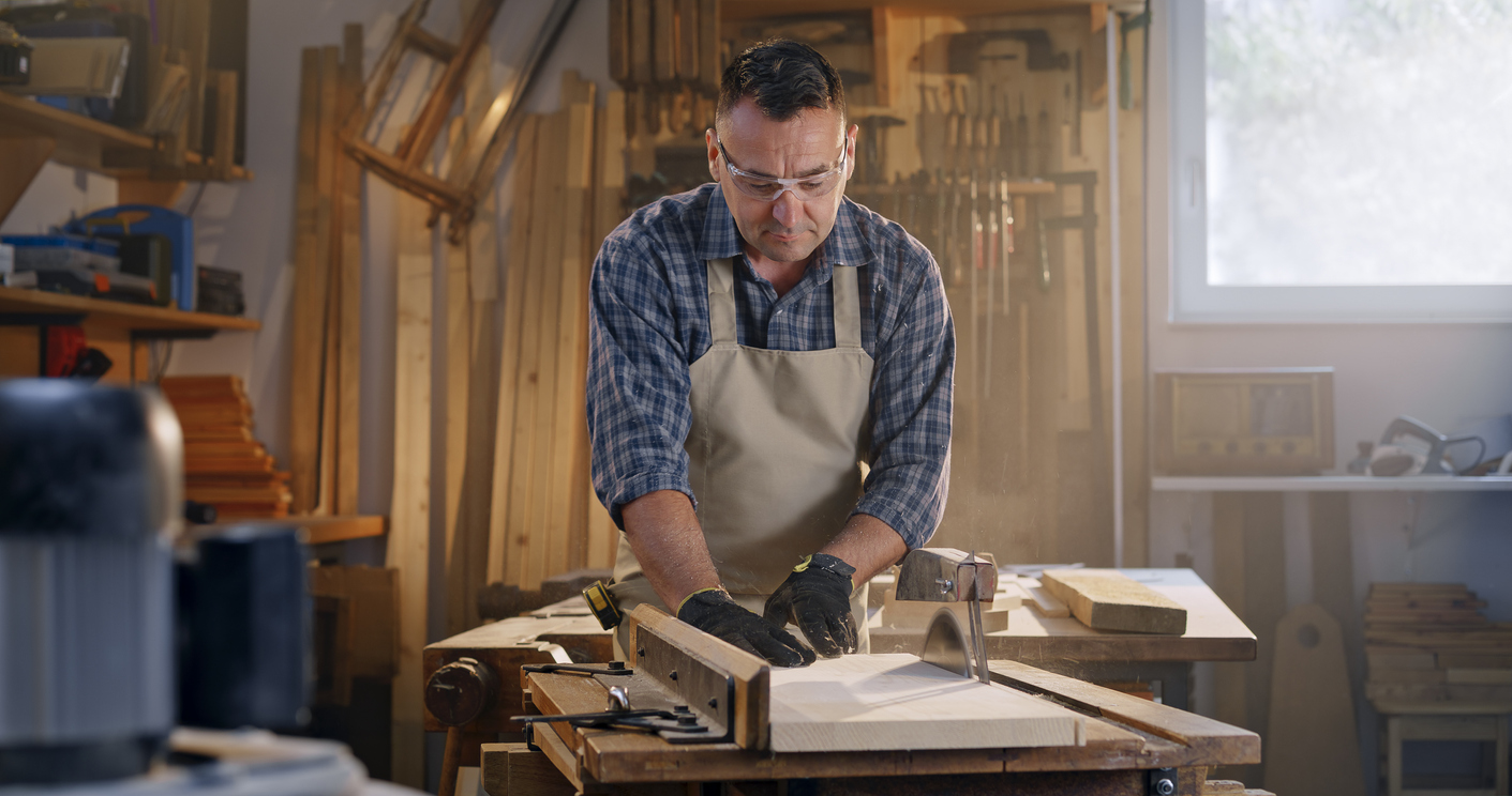 security window film man in workshop with tools window behind