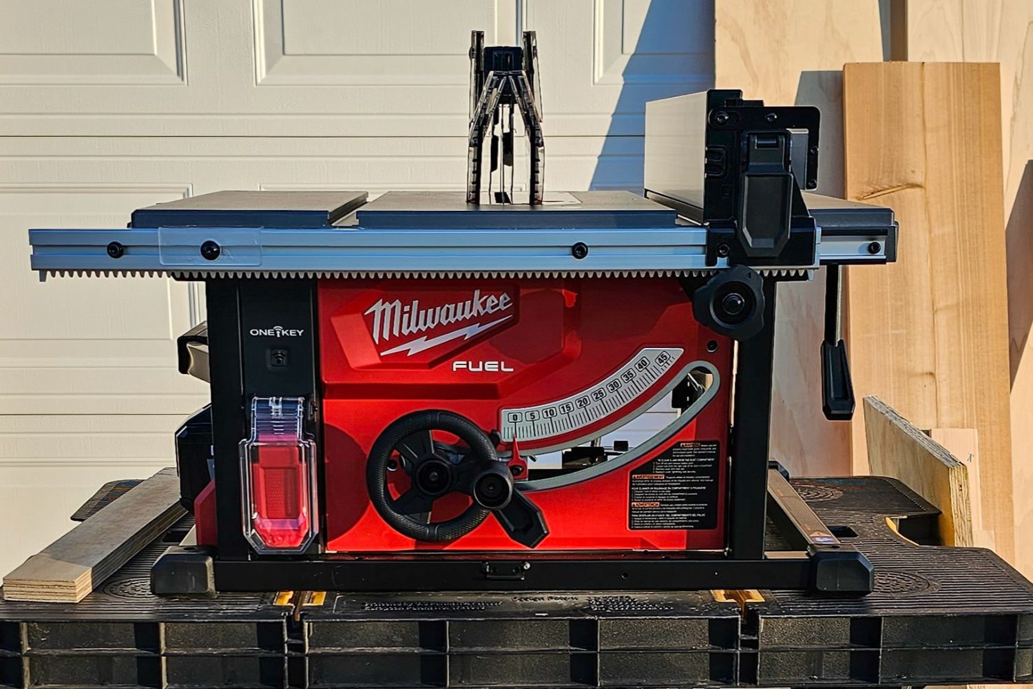 The best table saw option set up and ready for use in front of a garage