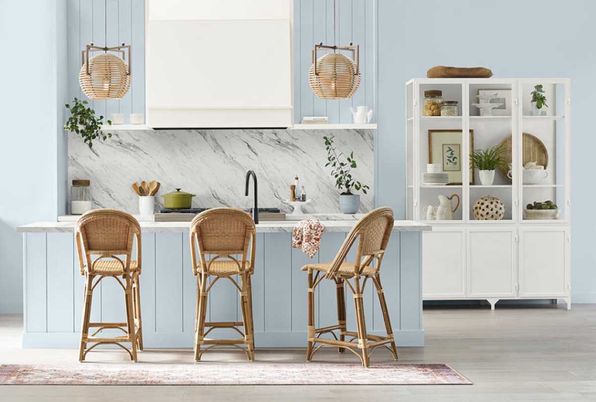 Kitchen with light blue walls and island.