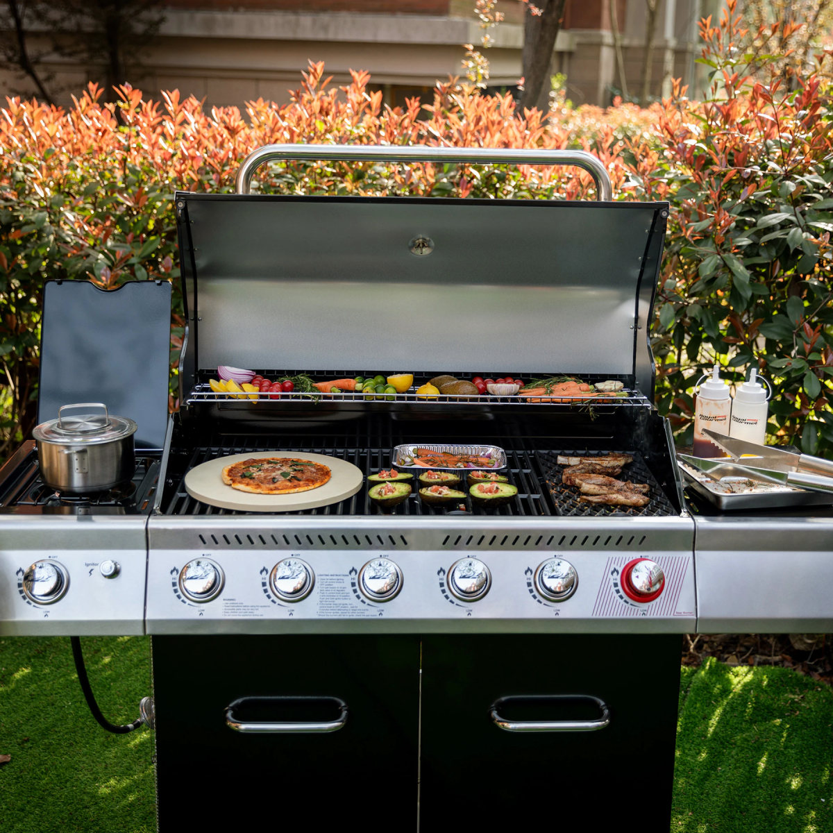 Royal Gourmet 6-Plus-1 Burner Grill searing ribs, vegetables, pizza, and more