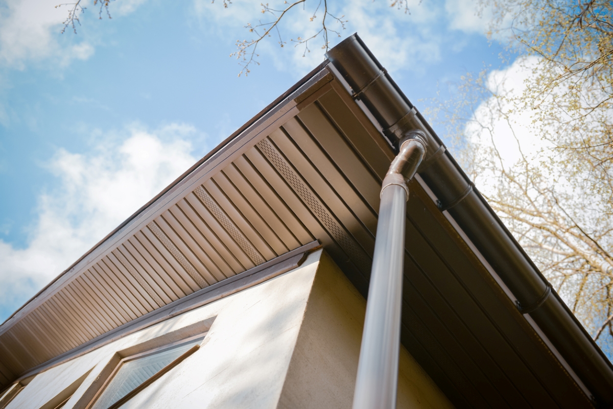 A view of underneath a home's exterior roof eave.