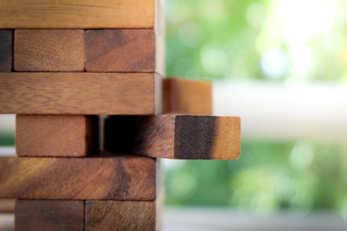 Oversized Jenga blocks sit outside.