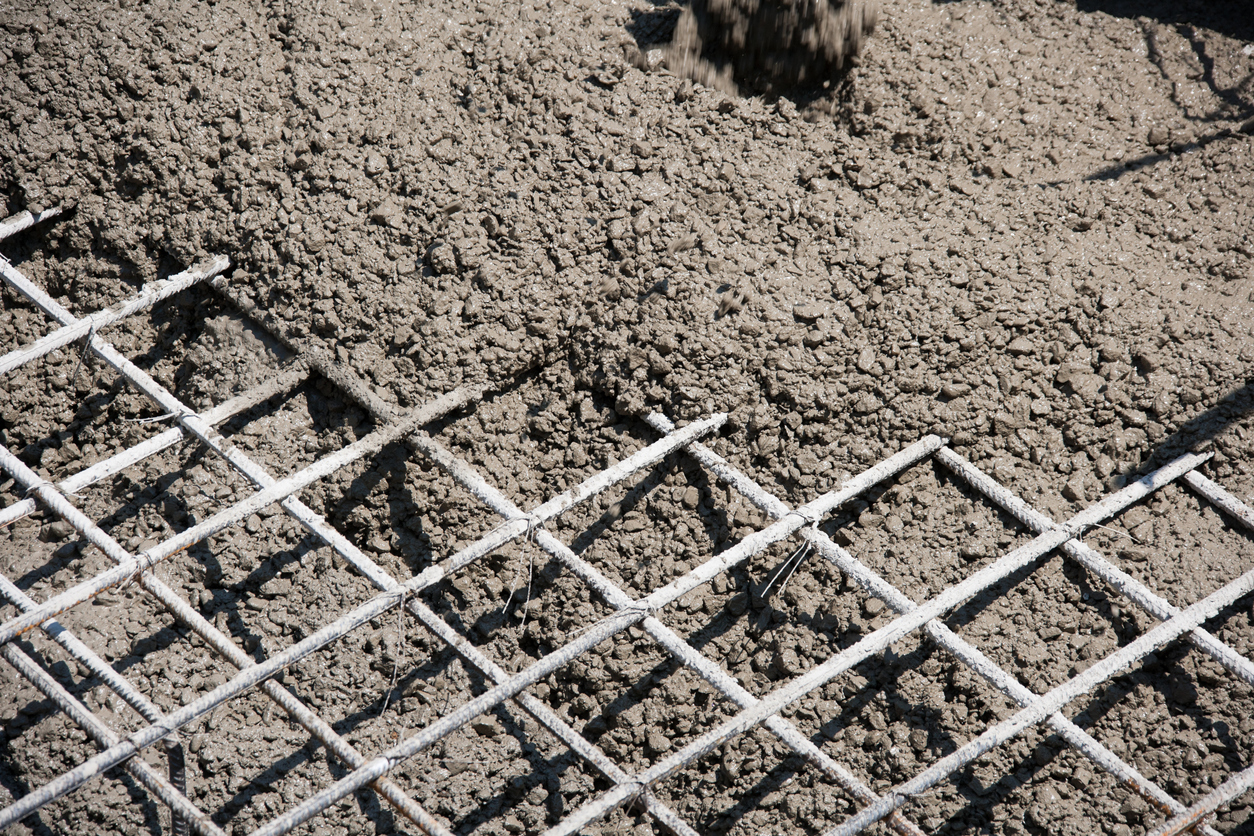 Pouring concrete into form.Reinforcing Steel Bars.