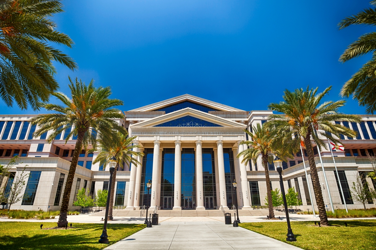 Large government building with palm trees