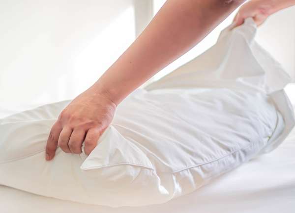 Woman prepping a pillow