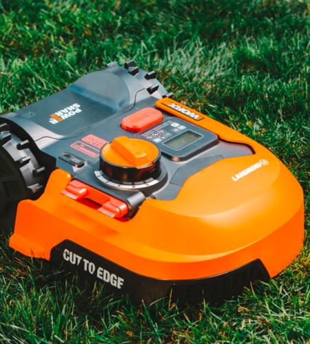 The Worx Landroid M robotic lawn mower sitting on grass