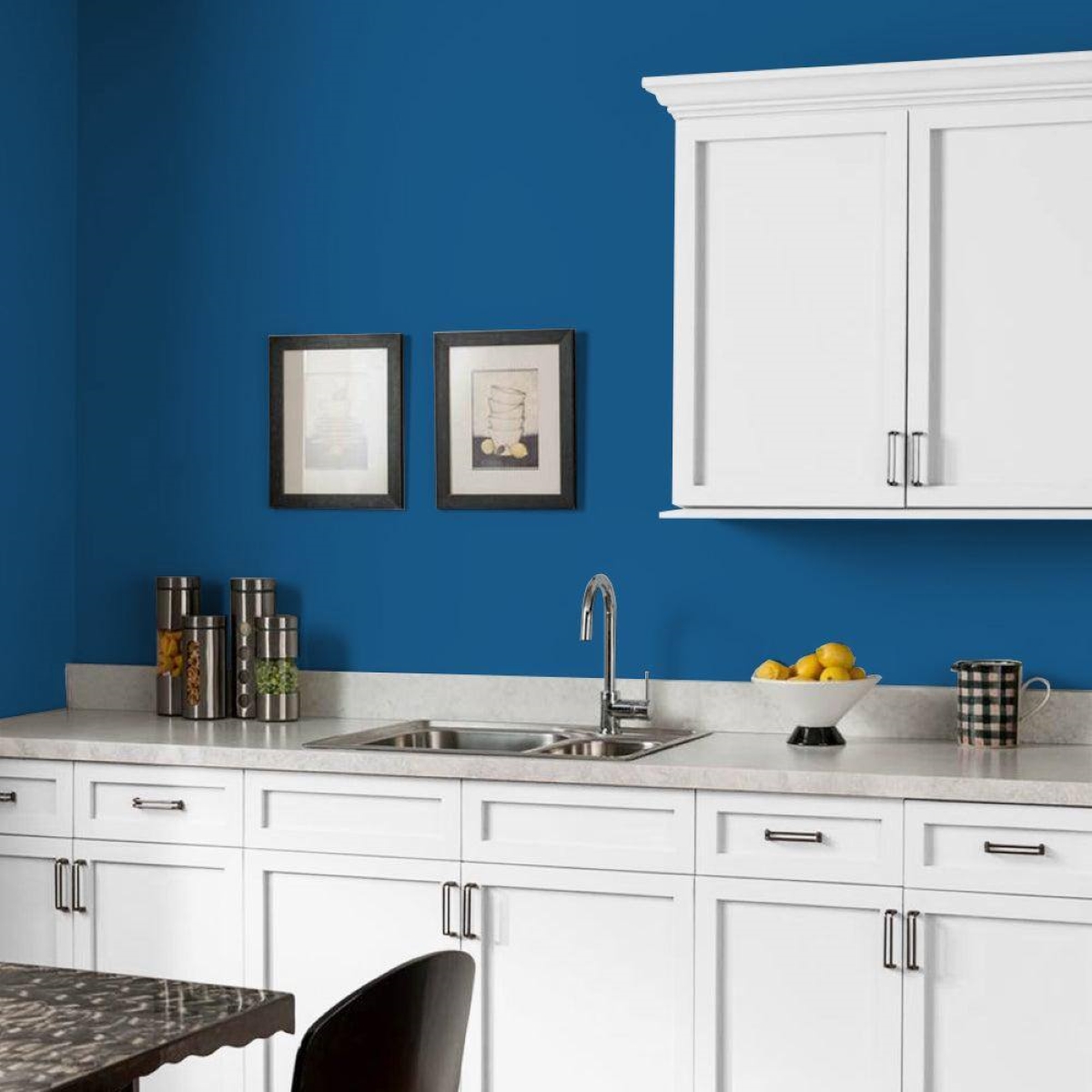 Kitchen with dark blue walls.