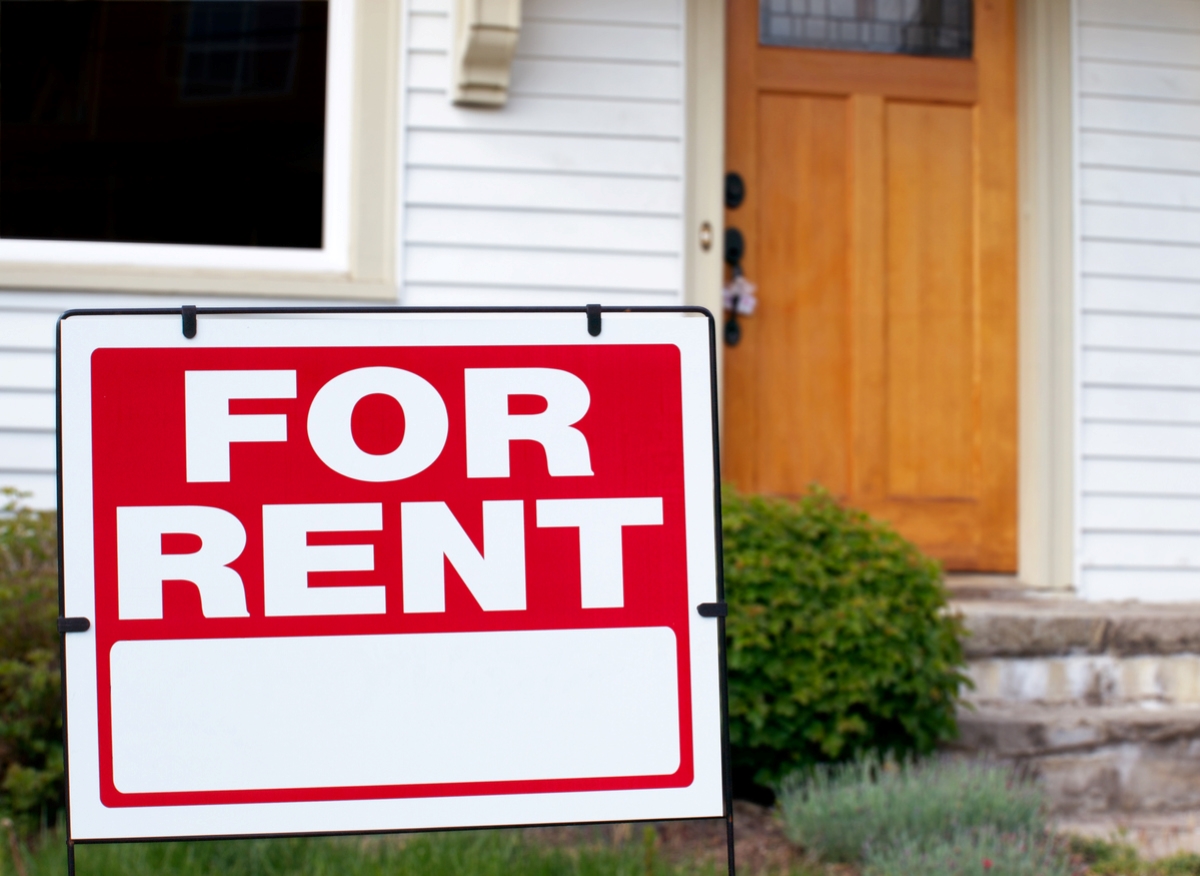 For rent sign in front of home.