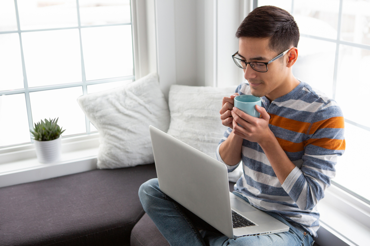 iStock-1392893532 short term rental renovations man enjoying coffee in coffee nook.jpg