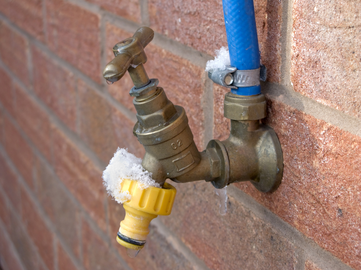 exterior faucet frozen with snow.