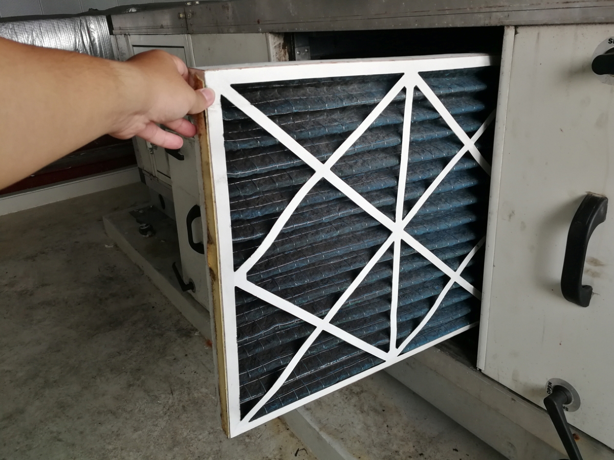 Person replacing air filter