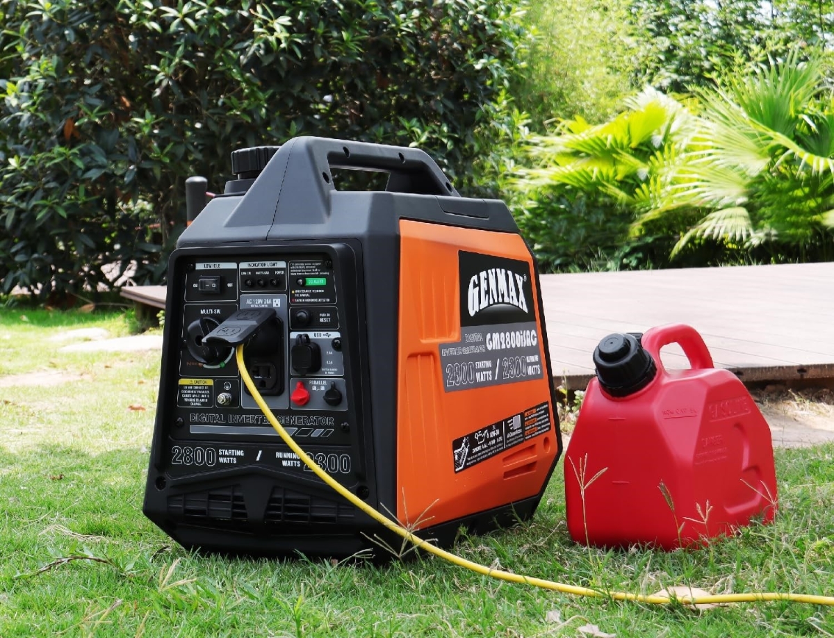 A portable inverter generator is used next to a red gas can.