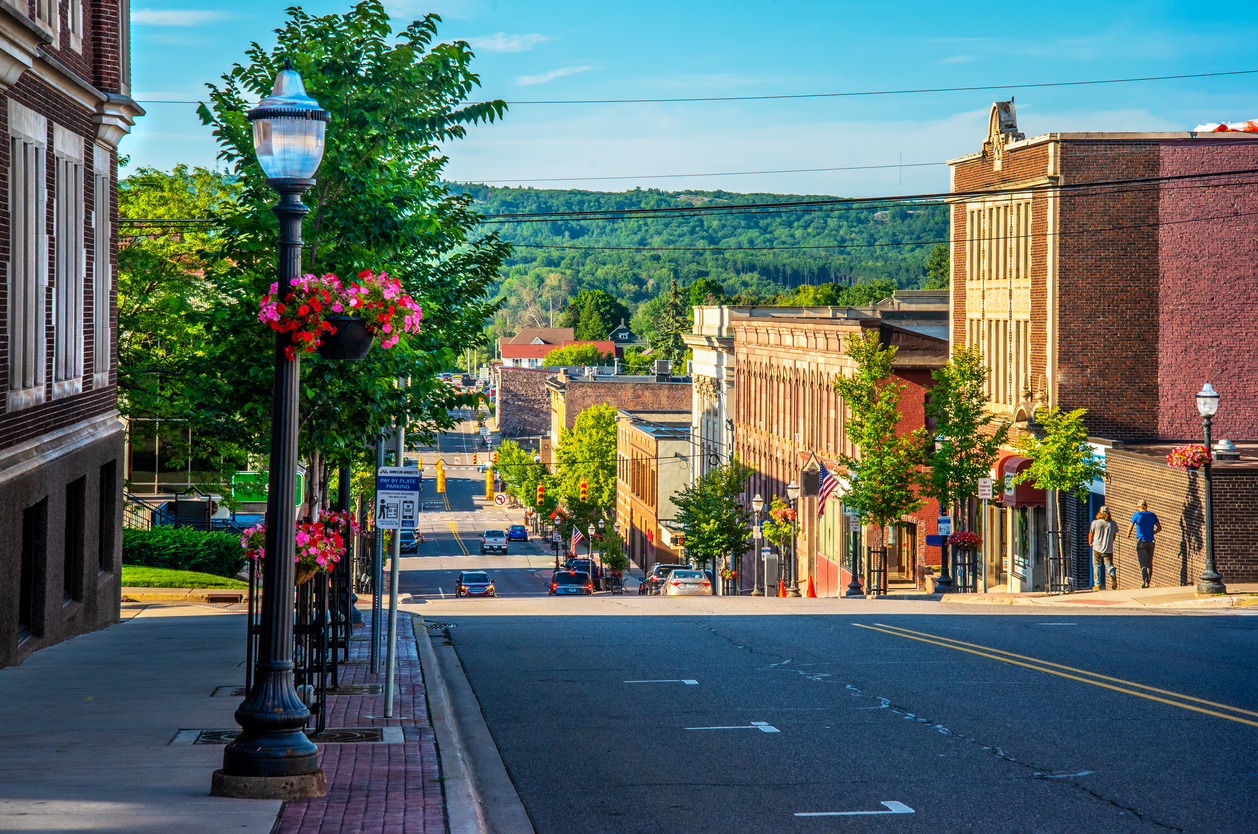 view of downtown marquette Michigan with forest and trees in the background