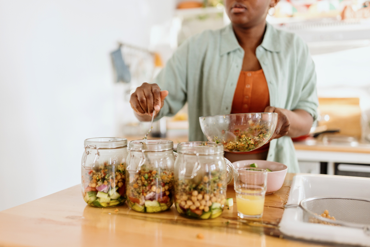 Woman preparing a nutritious and appetising meal in advance.