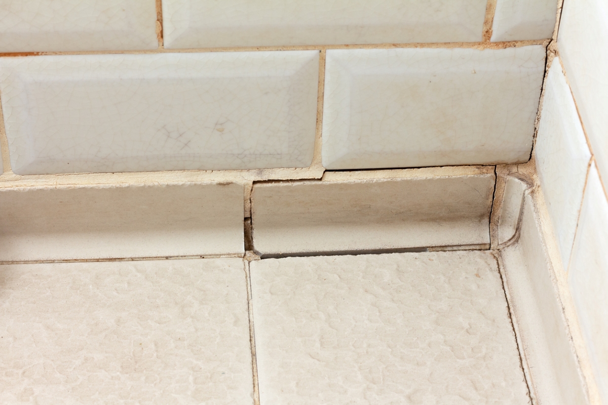 Cracked grout in bathroom floor