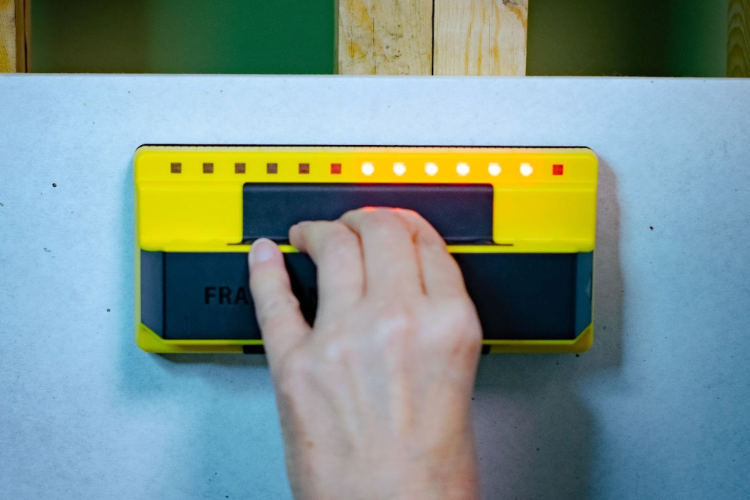 Glowing lights on the Franklin Sensors ProSensor 710 Stud Finder showing a stud behind drywall.