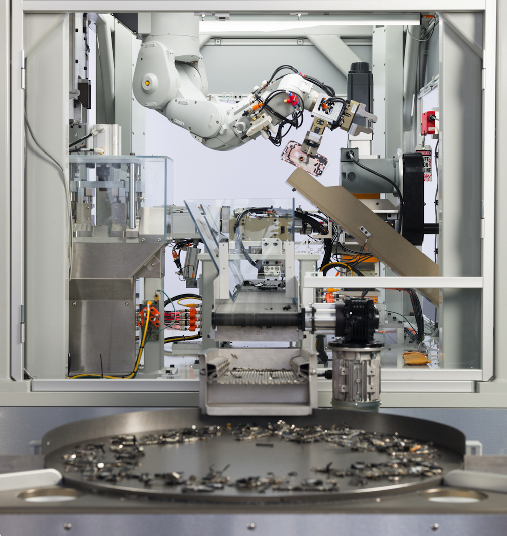 A product shot of a large machine that recycles iPhones.