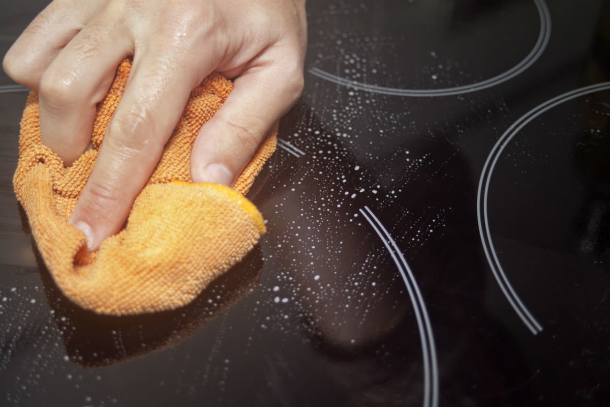 Close up of cleaning an electric stove