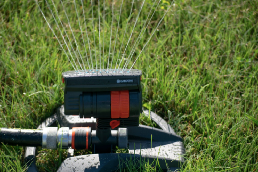 The Gardena ZoomMaxx Oscillating Sprinkler watering a lawn during testing.