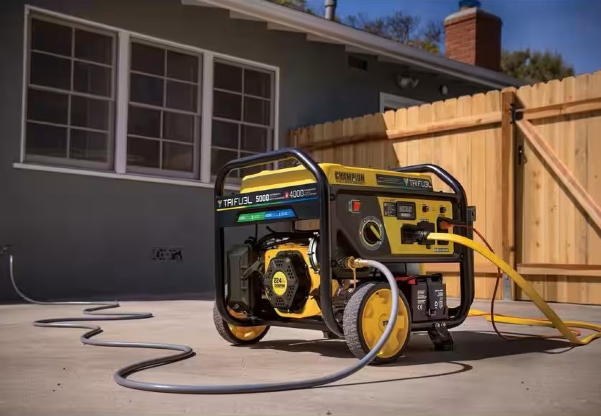 A generator is plugged in and running outside of a home.