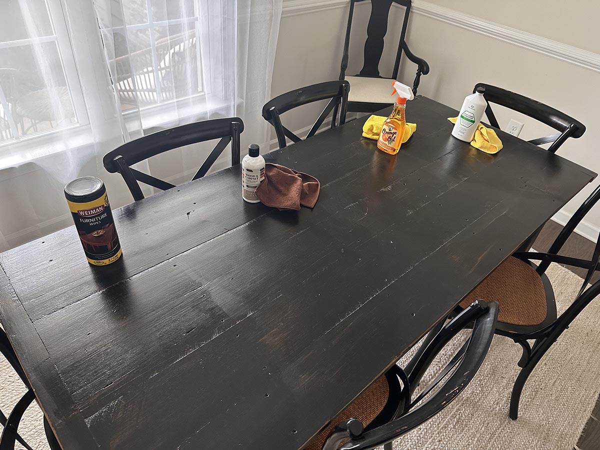 Four of the best wood cleaners on a wood table before testing.