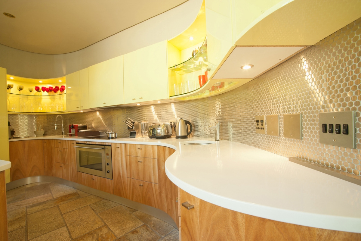 Large kitchen with tiny shiny backsplash.