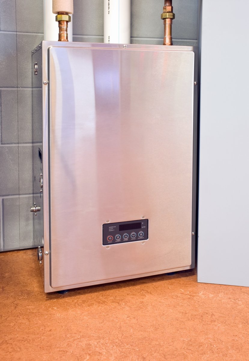 A tankless water heater installed in a home basement.