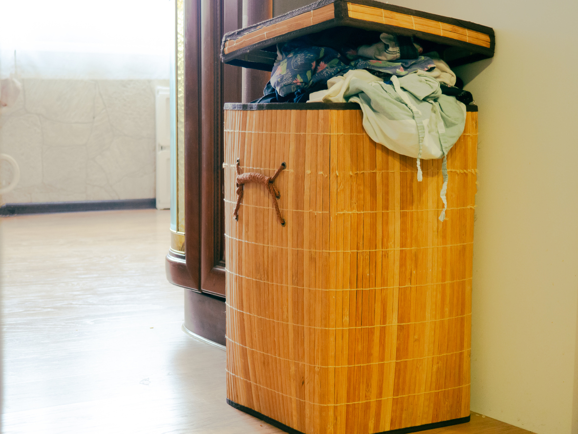 iStock-1365562379 smart places to hide safes Laundry basket, large wash, overflowing laundry