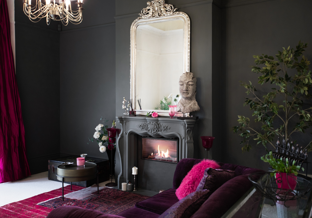 iStock-1294912743 Pantone Color Viva Magenta accents in dark room with fireplace.jpg